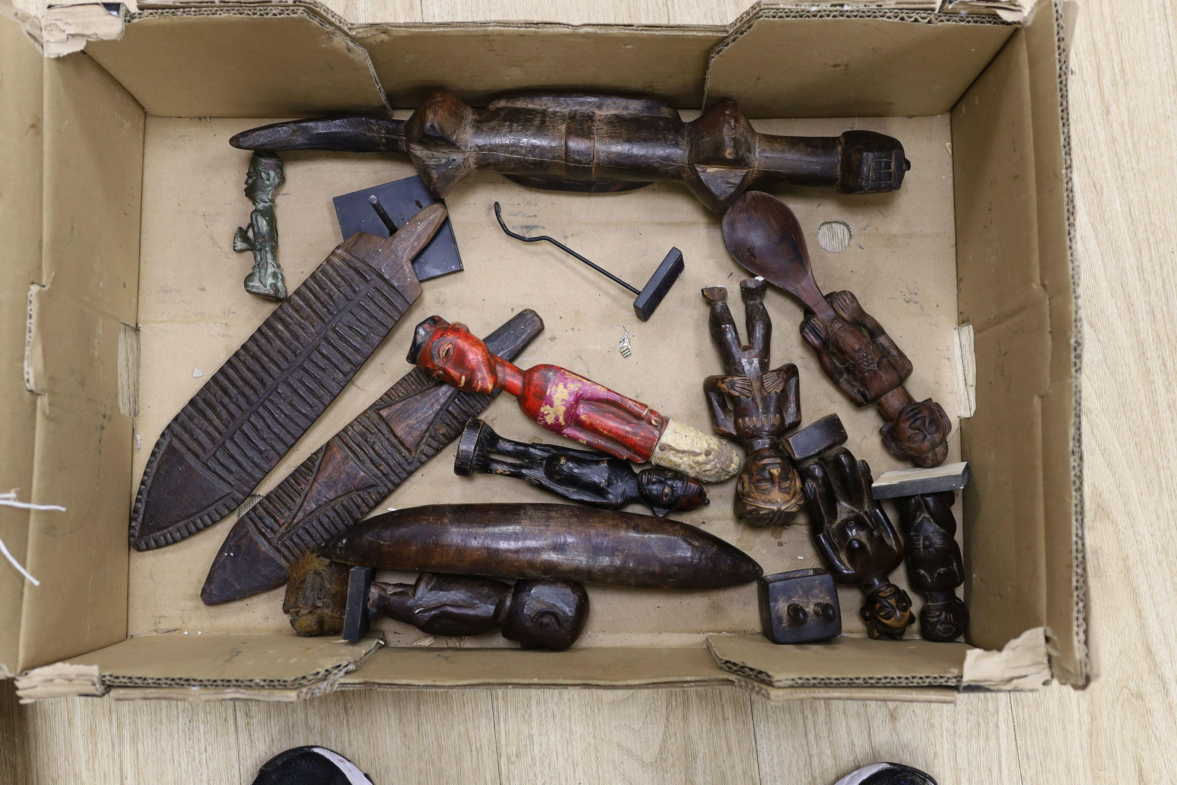 A large quantity of African wood carvings, gourd water carriers, etc.